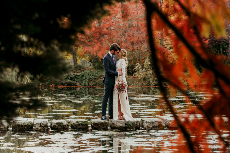 Bride Lace Backless Bridal Gown Intricate Autumn Leaves Headpiece Bouquet Garden Roses Seasonal Leaves Berries Groom Charcoal Suit Purple Patterned Tie Trees Lake From Dawn To Eternity Autumnal Wedding Ideas http://www.nataliaibarra.com
