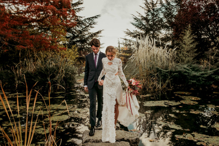 Bride Lace Backless Bridal Gown Bouquet Garden Roses Seasonal Leaves Berries Maroon Cream Ribbons Groom Charcoal Suit Purple Patterned Tie Trees From Dawn To Eternity Autumnal Wedding Ideas http://www.nataliaibarra.com