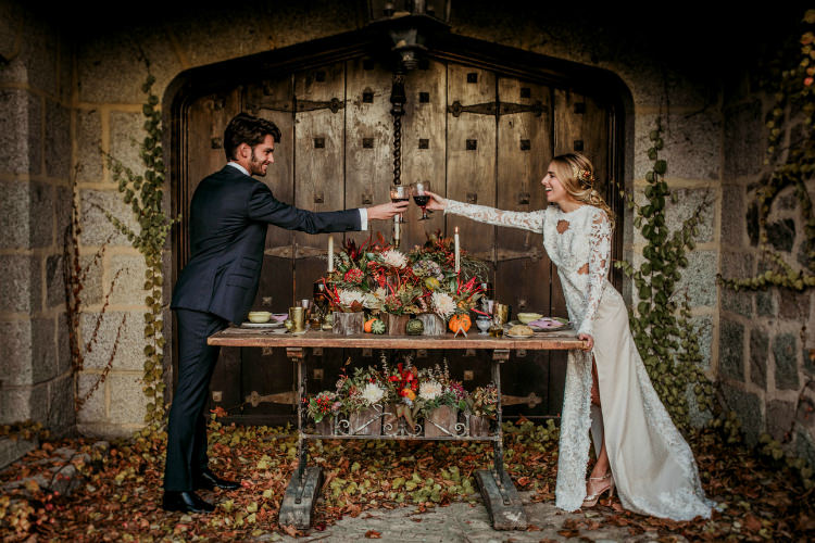 Bride Lace Backless Bridal Gown Intricate Autumn Leaves Headpiece Groom Charcoal Suit Rustic Recption Table Setting Fresh Flowers Pumpkins Gold Candlesticks From Dawn To Eternity Autumnal Wedding Ideas http://www.nataliaibarra.com