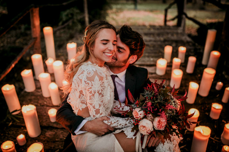 Bride Lace Backless Bridal Gown Bouquet Cream Garden Roses Seasonal Leaves Berries Maroon Cream Ribbons Groom Charcoal Suit Purple Patterned Tie Candles From Dawn To Eternity Autumnal Wedding Ideas http://www.nataliaibarra.com