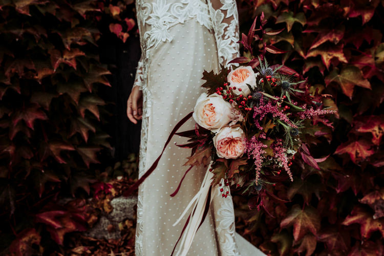 Bride Lace Backless Bridal Gown Bouquet Cream Garden Roses Seasonal Leaves Berries Long Maroon Cream Ribbons Groom Charcoal Suit Autumn Leaves From Dawn To Eternity Autumnal Wedding Ideas http://www.nataliaibarra.com