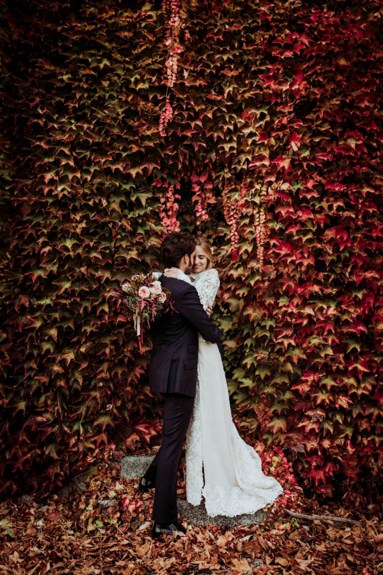 Bride Lace Backless Bridal Gown Bouquet Cream Garden Roses Seasonal Leaves Berries Long Maroon Cream Ribbons Groom Charcoal Suit Autumn Leaves From Dawn To Eternity Autumnal Wedding Ideas http://www.nataliaibarra.com