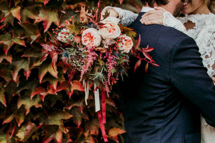 Bride Lace Backless Bridal Gown Bouquet Cream Garden Roses Seasonal Leaves Berries Long Ribbons From Dawn To Eternity Autumnal Wedding Ideas http://www.nataliaibarra.com