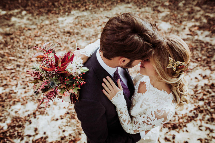 Bride Lace Backless Bridal Gown Intricate Autumn Leaves Headpiece Bouquet Groom Charcoal Suit Purple Patterned Tie From Dawn To Eternity Autumnal Wedding Ideas http://www.nataliaibarra.com