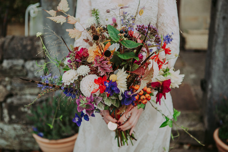 Bouquet Fowers Bride Bridal Feather Dahlias Wild Naturual Orange Red Yellow Autumn Weekend Extravaganza Tipi Wedding http://bloomweddings.co.uk/