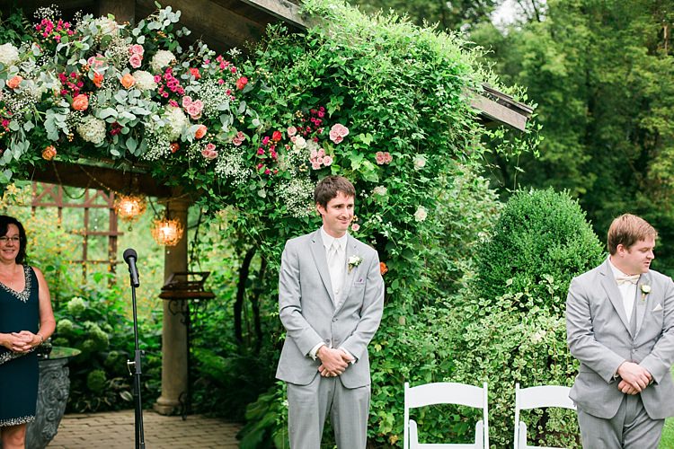Outdoor Ceremony Groom Light Grey Suit White Vest Tie Rose Buttonhole Groomsmen Light Grey Suit Celebrant Floral Arbour Flower Farm Outdoor Wedding Minnesota http://eileenkphoto.com/