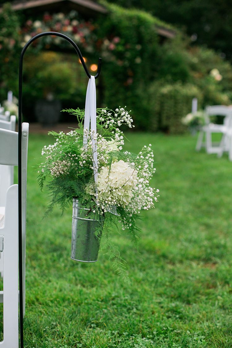 Outdoor Ceremony Potted White Flowers Gypsophila Silver Tin White Ribbon Floral Arbour Flower Farm Outdoor Wedding Minnesota http://eileenkphoto.com/