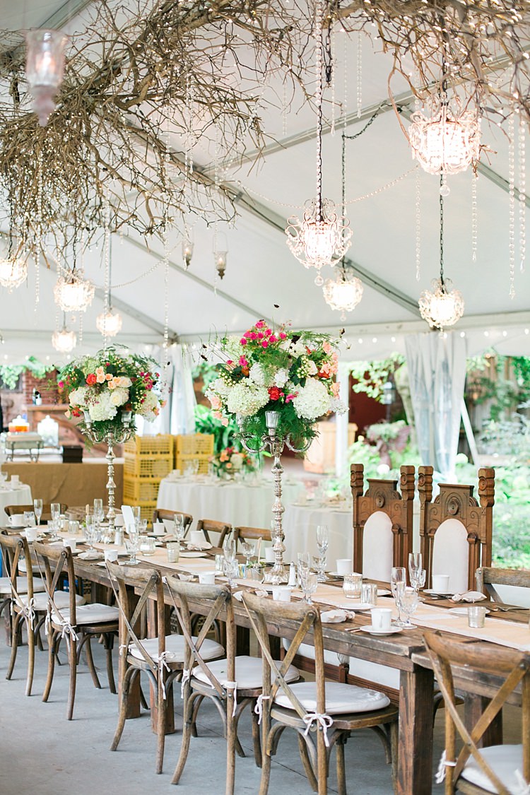 Reception Hanging Decor Chandeliers Wooden Table Large Bright Bouquets Centrepieces Fairy Lights Flower Farm Outdoor Wedding Minnesota http://eileenkphoto.com/