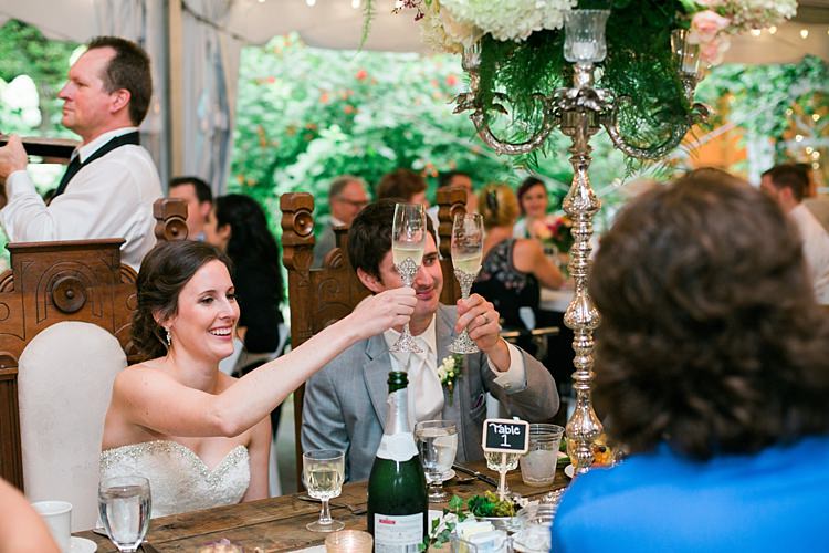 Reception Bride Embellished Strapless Bridal Gown Groom Light Grey Suit White Tie Champagne Toast Large Multicoloured Floral Centrepieces Guests Flower Farm Outdoor Wedding Minnesota http://eileenkphoto.com/