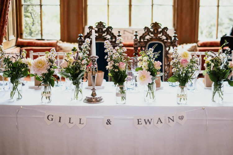 Top Table Floral Bunting Candle Vases Relaxed Stylish Outdoor Wedding http://www.euanrobertsonweddings.com/