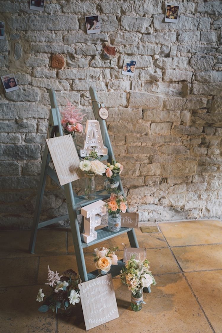 Ladder Decor Signs Flowers Pale Blue Peach Jars Light Pretty Summer Barn Wedding http://www.koweddings.com/
