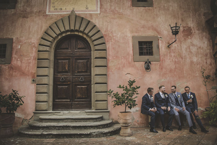 Groom Light Blue Suit White Shirt Textured Blue Tie Rose Buttonhole Groomsmen Dark Blue Suits White Shirt Blue Ties Historic Pink Villa Romantic Intimate Tuscany Destination Wedding http://angelicabraccini.com/