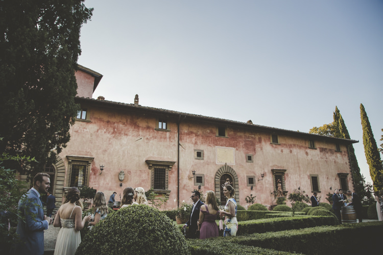 Outdoor Ceremony Location Historic Pink Villa Guests Hedges Romantic Intimate Tuscany Destination Wedding http://angelicabraccini.com/