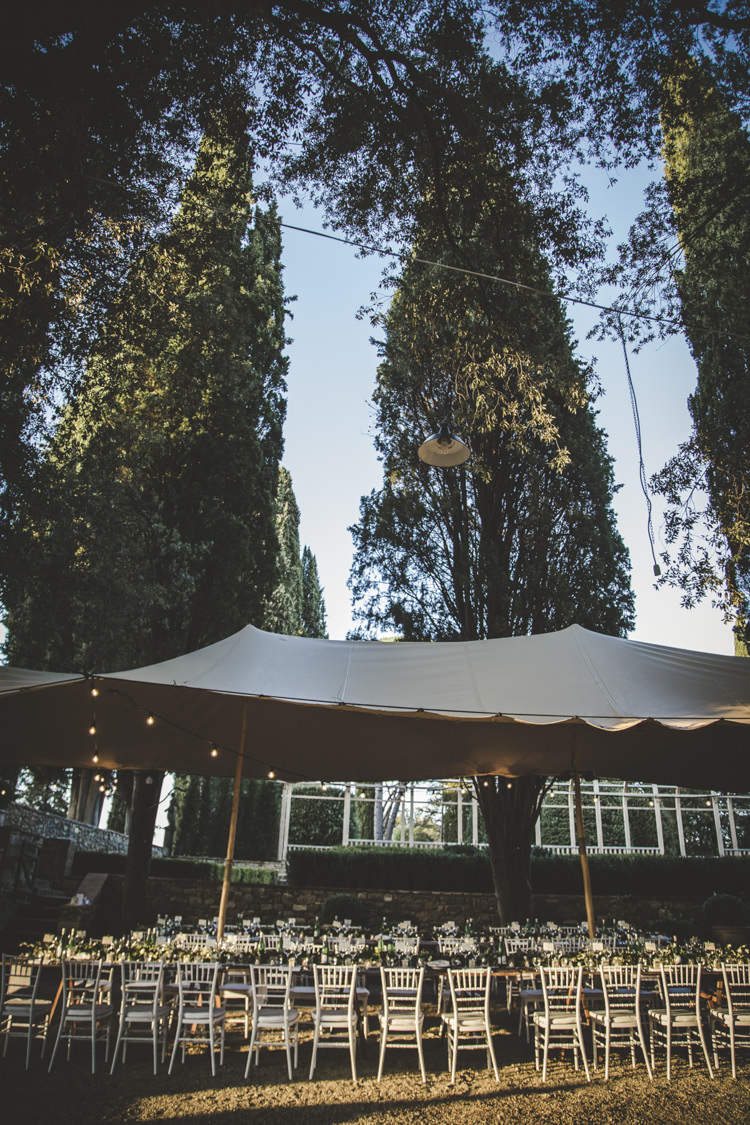 Reception Location Marquee Long Tables White Chairs Tall Trees Romantic Intimate Tuscany Destination Wedding http://angelicabraccini.com/