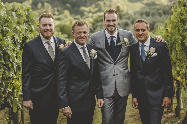 Groom Light Blue Suit Blue Vest Textured Blue Tie Groomsmen Dark Blue Suit White Shirt Different Ties Rose Buttonholes Vineyard Romantic Intimate Tuscany Destination Wedding http://angelicabraccini.com/