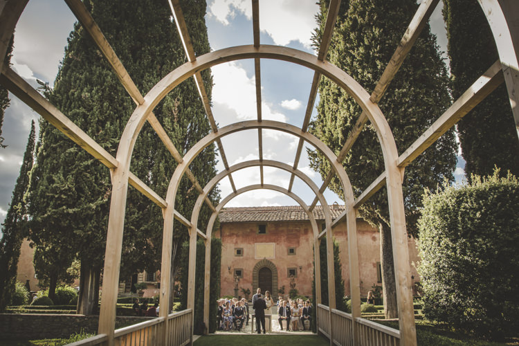 Ceremony Location Historic Pink Villa Archway Trees Hedges Romantic Intimate Tuscany Destination Wedding http://angelicabraccini.com/