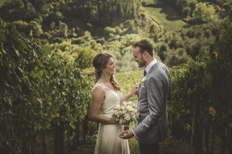 Bride Lace Tulle Stella York Bridal Gown Bouquet White Pink Roses Groom Light Blue Suit White Shirt Textured Blue Tie Rose Buttonhole Vineyard Romantic Intimate Tuscany Destination Wedding http://angelicabraccini.com/