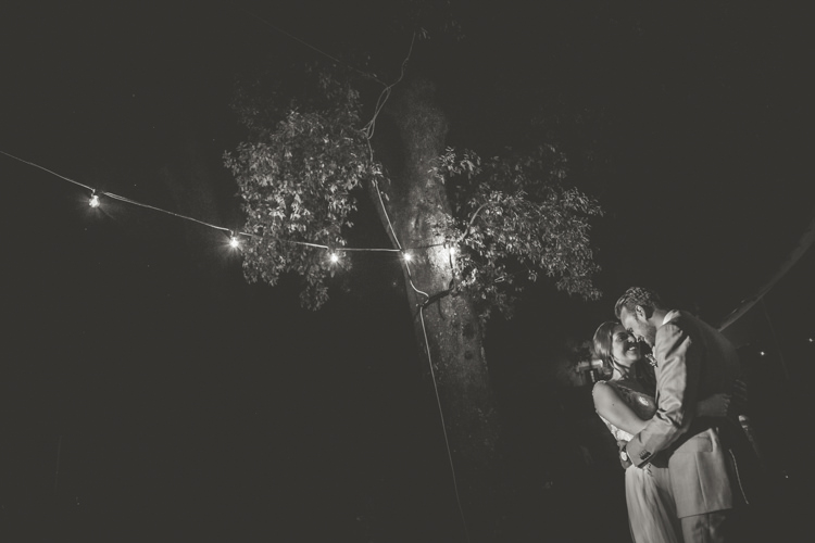 Reception Outdoor First Dance Bride Lace Tulle Stella York Bridal Gown Groom Light Blue Suit Trees Fairy Lights Romantic Intimate Tuscany Destination Wedding http://angelicabraccini.com/