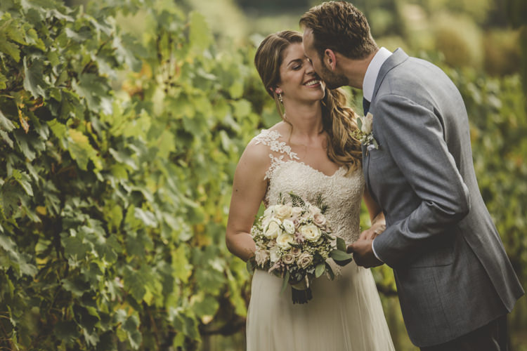 Bride Lace Tulle Stella York Bridal Gown Bouquet White Pink Roses Groom Light Blue Suit White Shirt Textured Blue Tie Rose Buttonhole Vineyard Romantic Intimate Tuscany Destination Wedding http://angelicabraccini.com/