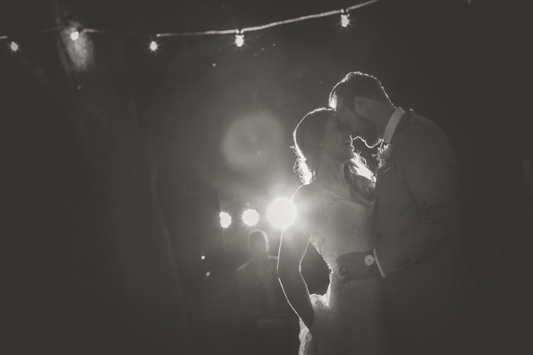 Reception Outdoor First Dance Bride Lace Tulle Stella York Bridal Gown Groom Light Blue Suit Trees Fairy Lights Romantic Intimate Tuscany Destination Wedding http://angelicabraccini.com/