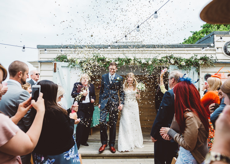 Confetti Throw Bride Groom Low Key Pastel Seaside Wedding http://holliecarlinphotography.com/