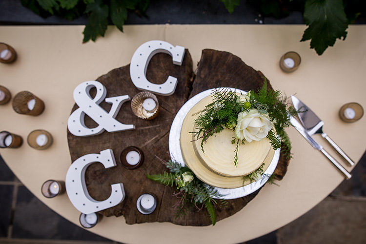 Cake Table Log Candles Letters Decor Whimsical Greenery Nature Wedding http://lunaweddings.co.uk/