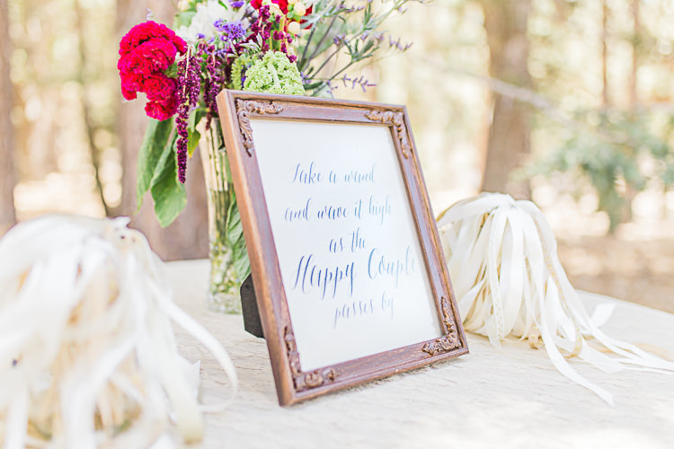 Outdoor Ceremony White Ribbon Wands Framed Calligraphy Sign Multicoloured Flowers Glass Vase DIY Whimsical Camp Wedding California http://www.landbphotography.org/