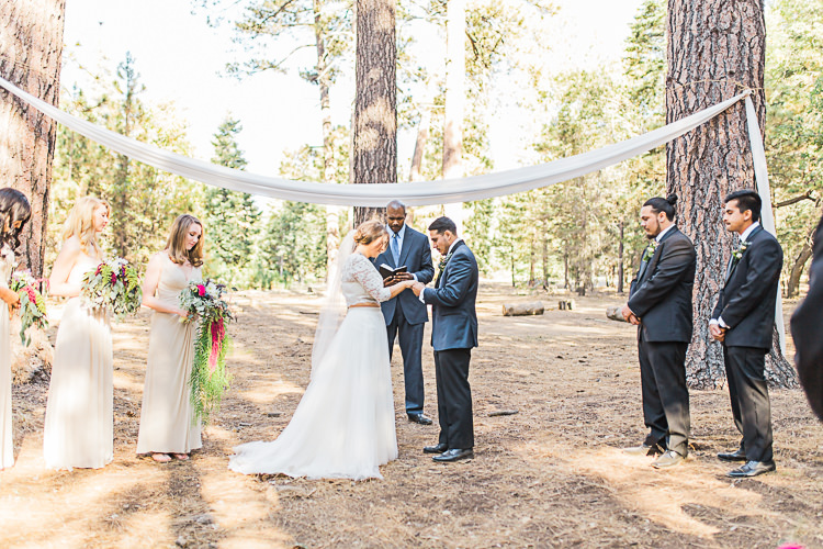 Outdoor Ceremony Bride Watters Separates Lace Top Tulle Skirt Veil Cascading Multicoloured Bouquet Groom Dark Blue Jacket Black Satin Lapel Black Pants Bowtie Groomsmen Black Suits Bridesmaids Ivory Dresses Celebrant DIY Whimsical Camp Wedding California http://www.landbphotography.org/