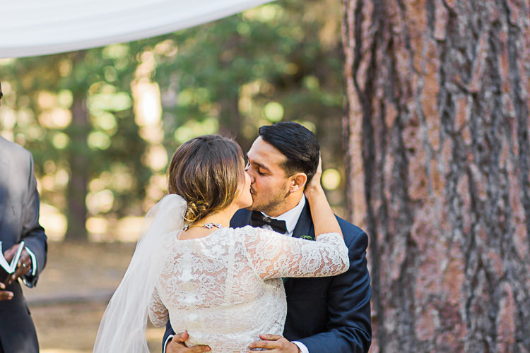Outdoor Ceremony Bride Watters Separates Lace Top Tulle Skirt Veil Groom Dark Blue Jacket Black Satin Lapel Black Bowtie Kiss DIY Whimsical Camp Wedding California http://www.landbphotography.org/