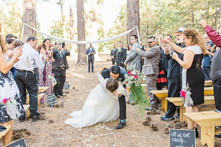 Outdoor Ceremony Bride Watters Separates Lace Top Tulle Skirt Cascading Multicoloured Bouquet Groom Dark Blue Jacket Black Pants Kiss Guests DIY Whimsical Camp Wedding California http://www.landbphotography.org/