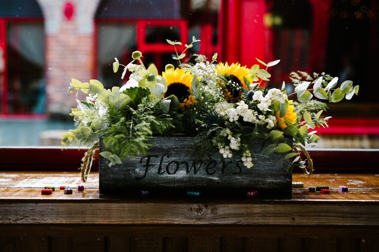 Crate Flowers Foliage Greenery Sunflowers Alternative Lego Aviation Wedding http://www.honeyandthemoonphotography.co.uk/