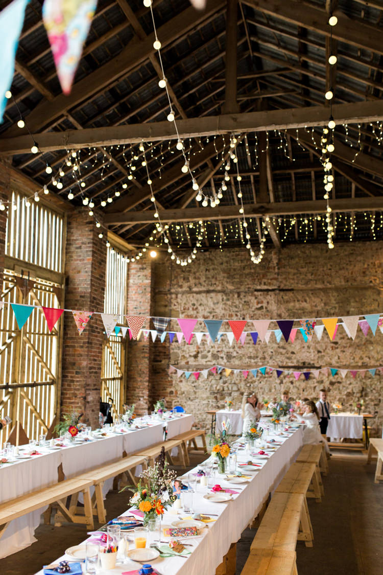 Barn Bunting Festoon Lights Long Tables Colourful Decor Beautiful Woodland Glade Wedding https://emilyhannah.com/
