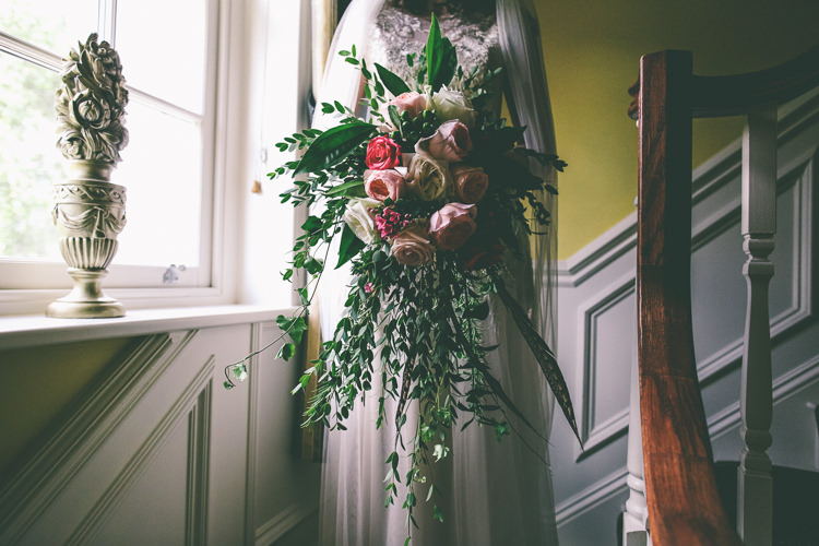 Pink Red Rose Bouquet Greenery Foliage Large Feathers Cascading Rustic Woodland Birds Outdoorsy Wedding http://www.emmaboileau.co.uk/
