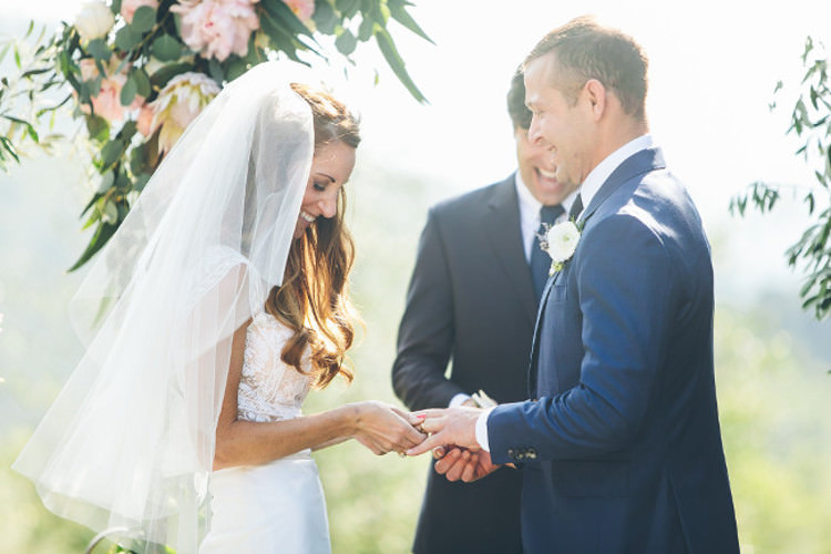 Outdoor Ceremony Bride Lace Mermaid Two Piece Bridal Gown Veil Groom Royal Blue Suit Celebrant Floral Arch Beautiful Pink Blue Tuscany Villa Wedding http://www.chloemurdochphotography.com/