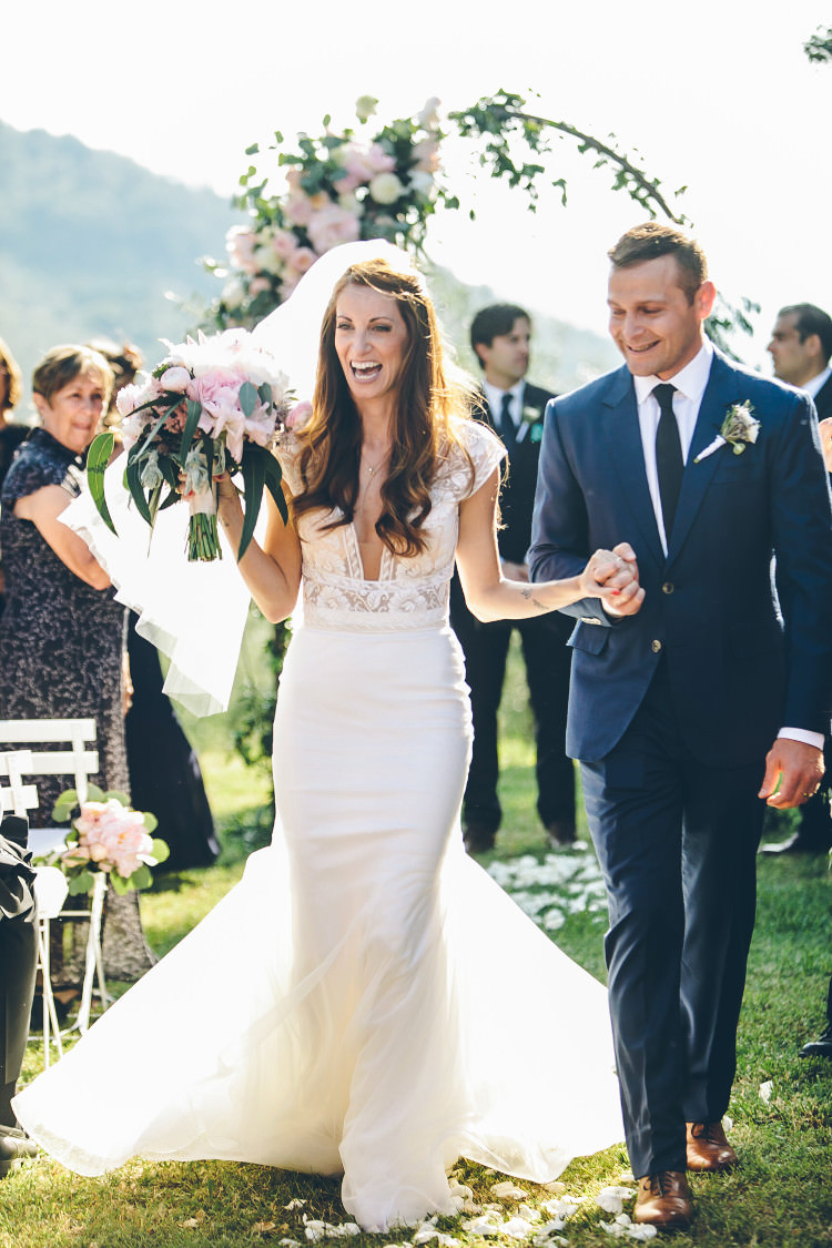 Outdoor Ceremony Bride Two Piece Mermaid Bridal Gown Veil Bouquet Groom Royal Blue Suit White Shirt Dark Blue Tie Floral Arch Guests Beautiful Pink Blue Tuscany Villa Wedding http://www.chloemurdochphotography.com/