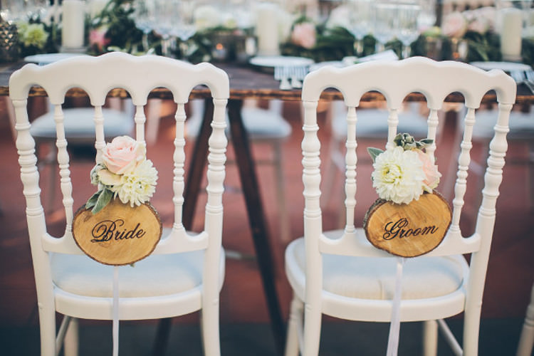 Reception Bridal Party Table White Chairs Wooden Bride Groom Signs White Pink Florals Beautiful Pink Blue Tuscany Villa Wedding http://www.chloemurdochphotography.com/