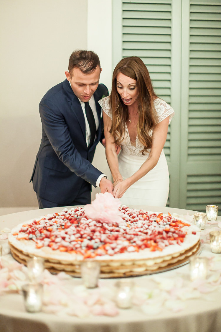 Reception Cake Cutting Bride Lace Two Piece Mermaid Bridal Gown Groom Royal Blue Suit White Shirt Dark Blue Tie Beautiful Pink Blue Tuscany Villa Wedding http://www.chloemurdochphotography.com/