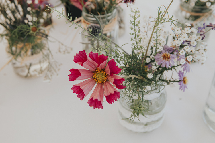 Jar Flowers Beautiful Flowery Country Marquee Wedding http://www.maddiefarrisphotography.co.uk/