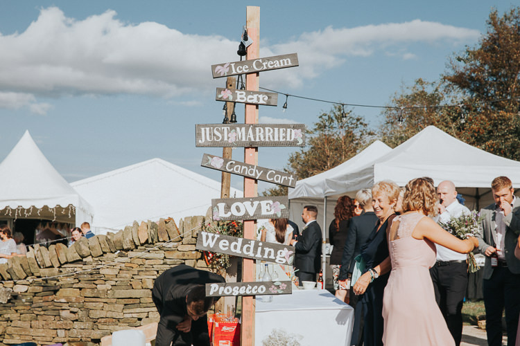 Rustic Wooden Sign Post Beautiful Flowery Country Marquee Wedding http://www.maddiefarrisphotography.co.uk/
