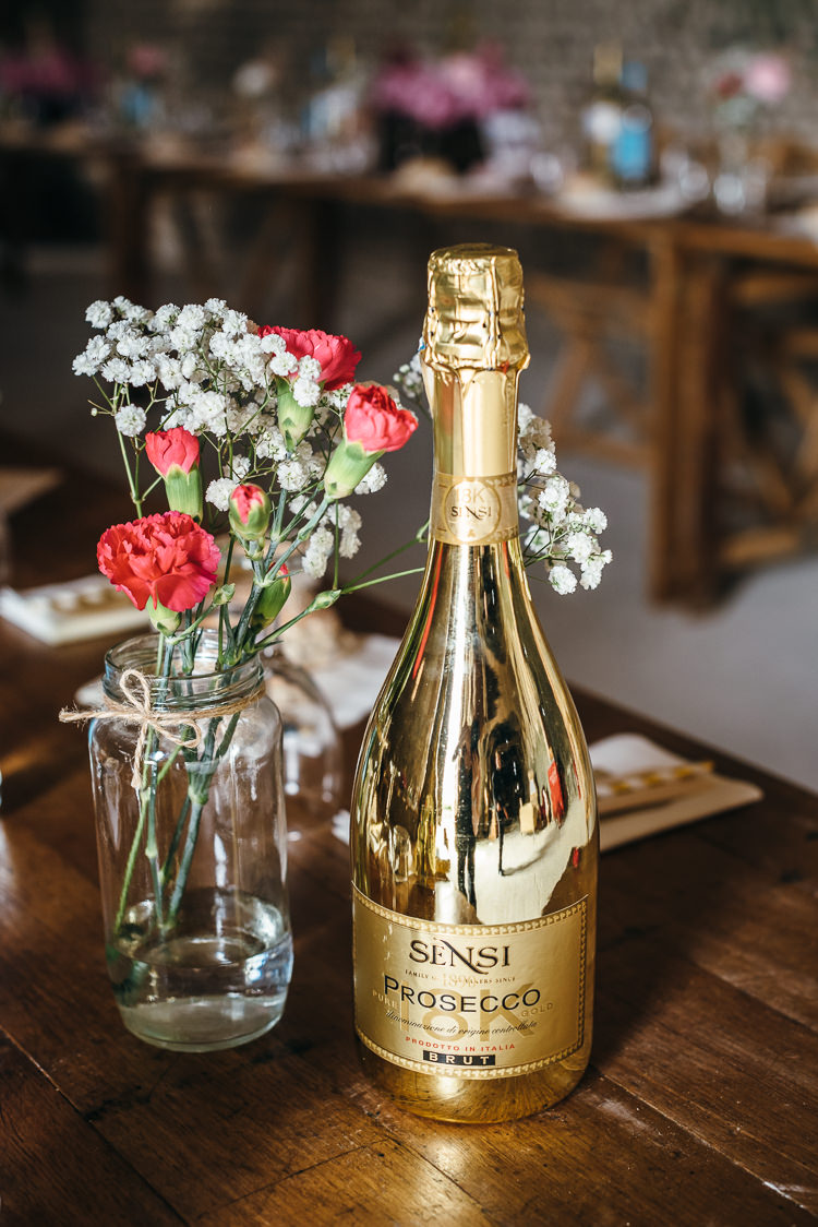 Prosecco Drink Bottle Jar Flowers Decor Gorgeous Home Made Pink Gold Barn Wedding http://www.bethmoseleyphotography.co.uk/