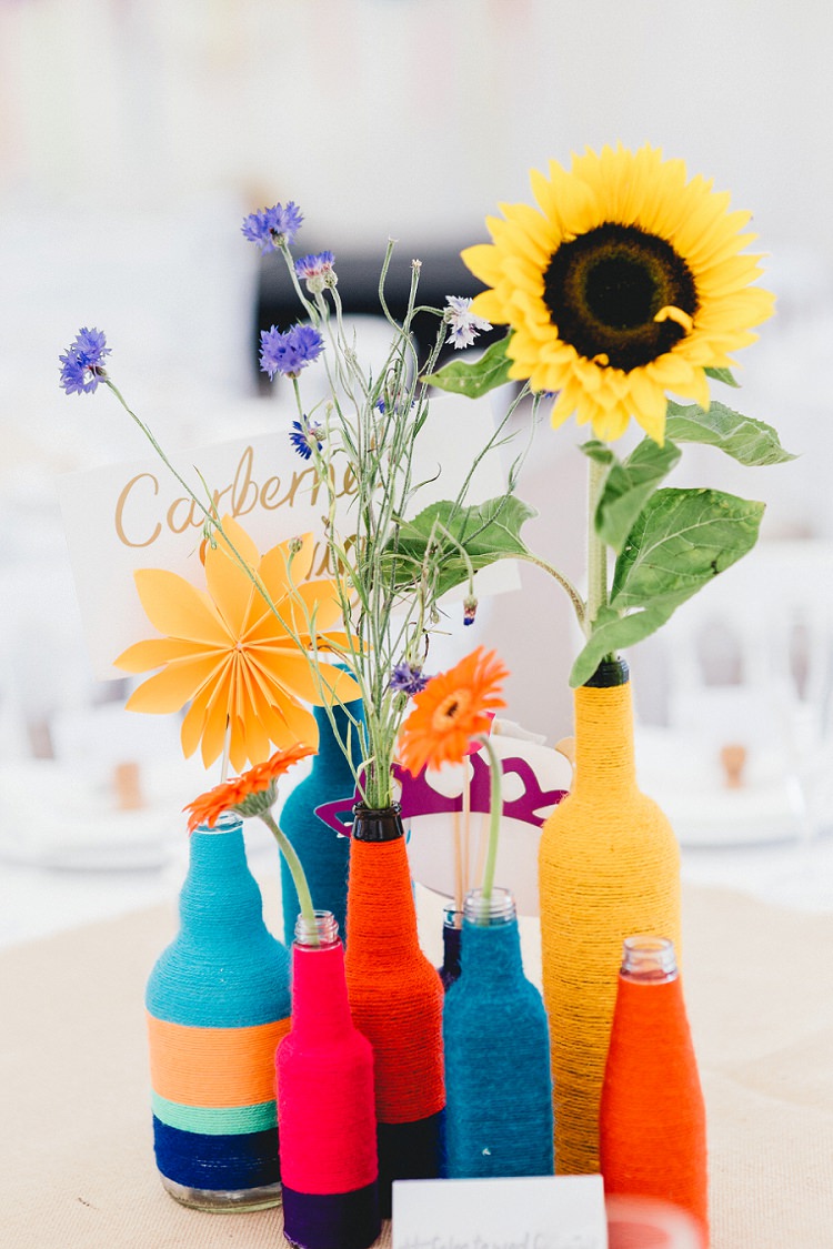 Twine Wool String Bottles Rainbow Flowers Centrepiece Decor All Things Big Bright Beautiful Multicolour Wedding http://benjaminmathers.co.uk/ 