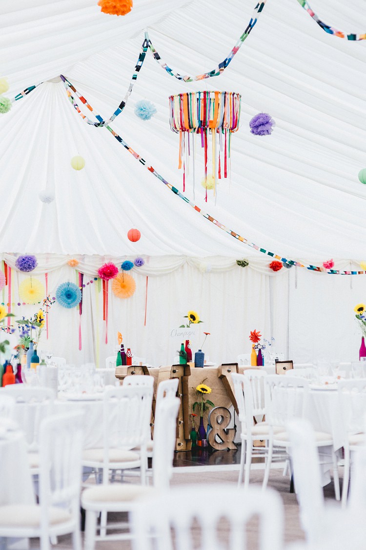 Rainbow Marquee Decor Paper Chains Ribbons Pinwheels Pom Poms All Things Big Bright Beautiful Multicolour Wedding http://benjaminmathers.co.uk/