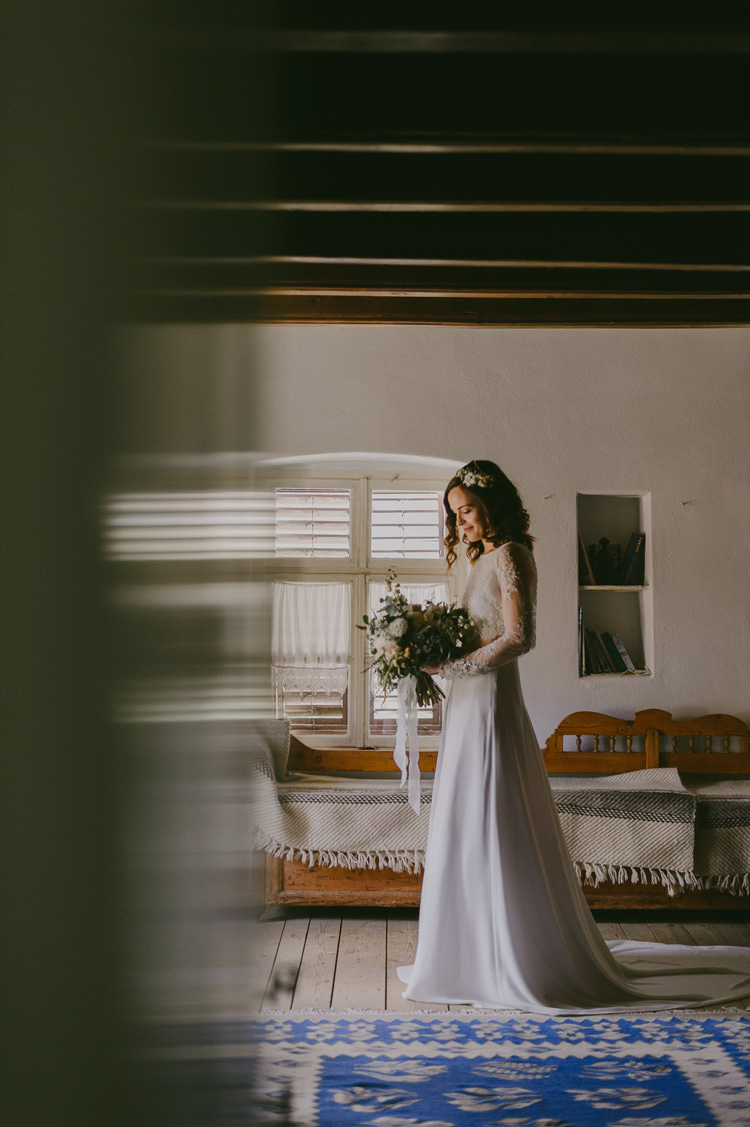 Bride Two Piece Lace Bridal Gown Floral Hairpiece Bouquet White Florals Roses Greenery White Ribbon Loose Curls Hairstyle Natural Greenery Stylish Wedding Transylvania https://raresion.com/