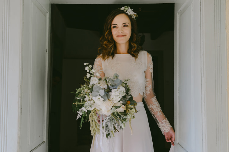 Bride Two Piece Lace Bridal Gown Floral Headpiece Bouquet White Florals Roses Greenery White Ribbon Loose Curls Hairstyle Natural Greenery Stylish Wedding Transylvania https://raresion.com/