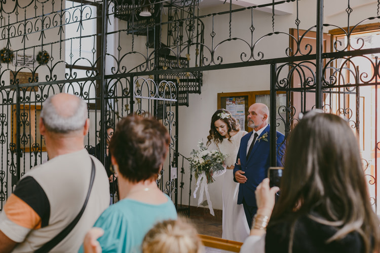 Church Ceremony Bride Two Piece Lace Bridal Gown Floral Hairpiece Bouquet White Florals Greenery White Ribbon Father Entrance Guests Natural Greenery Stylish Wedding Transylvania https://raresion.com/