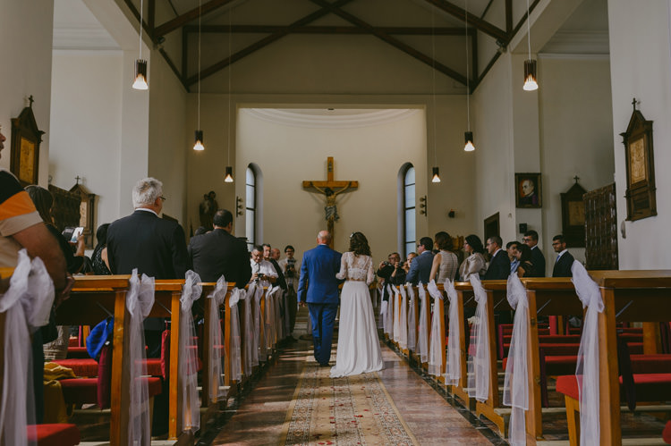 Church Ceremony Bride Two Piece Lace Bridal Gown Floral Hairpiece Father Entrance Guests Natural Greenery Stylish Wedding Transylvania https://raresion.com/