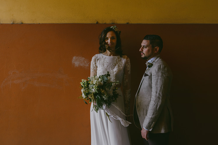 Bride Two Piece Lace Bridal Gown Floral Hairpiece Groom Light Blue Shirt Sand Jacket Dark Grey Vest Brown Pants Patterned Bowtie Floral Buttonhole Natural Greenery Stylish Wedding Transylvania https://raresion.com/