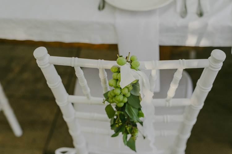 Reception White Chairs Grapes Greenery White Ribbon Natural Greenery Stylish Wedding Transylvania https://raresion.com/