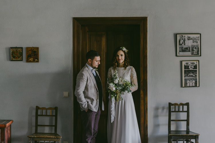 Bride Two Piece Lace Bridal Gown Floral Hairpiece Bouquet White Florals Greenery White Ribbon Groom Light Blue Shirt Sand Jacket Dark Grey Vest Brown Pants Patterned Bowtie Natural Greenery Stylish Wedding Transylvania https://raresion.com/