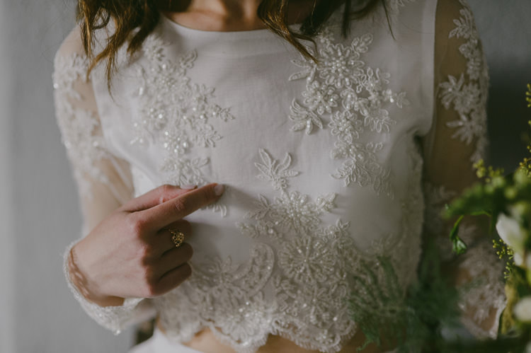 Bride Two Piece Lace Embellished Bridal Gown Loose Curls Hairstyle Bouquet White Florals Greenery Natural Greenery Stylish Wedding Transylvania https://raresion.com/